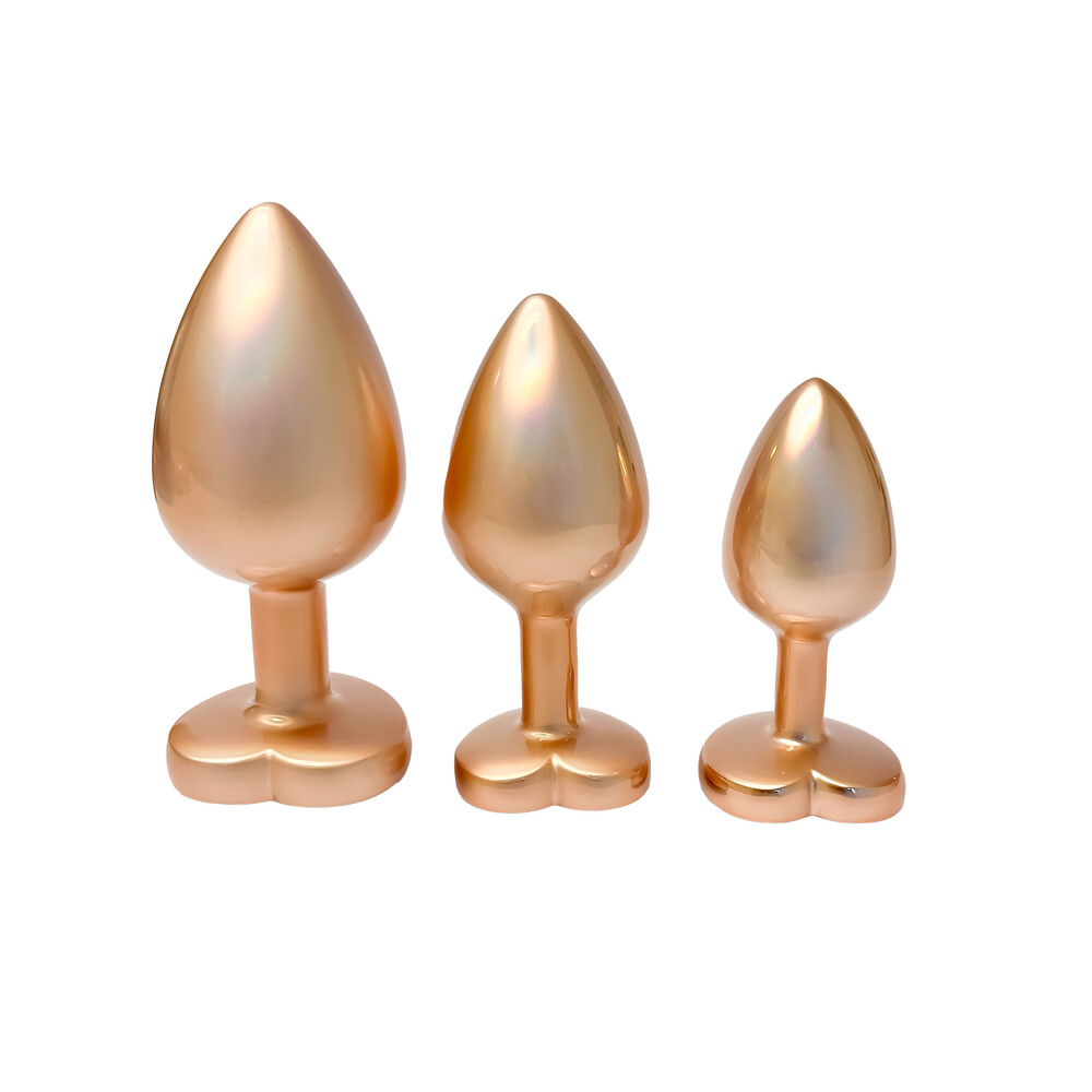 The Gleaming Love Pearl Gold Butt Plug Set from Forbidden Passion